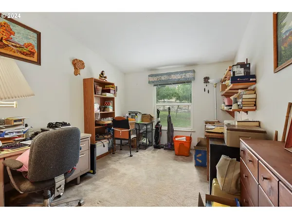 a workspace with furniture and a window