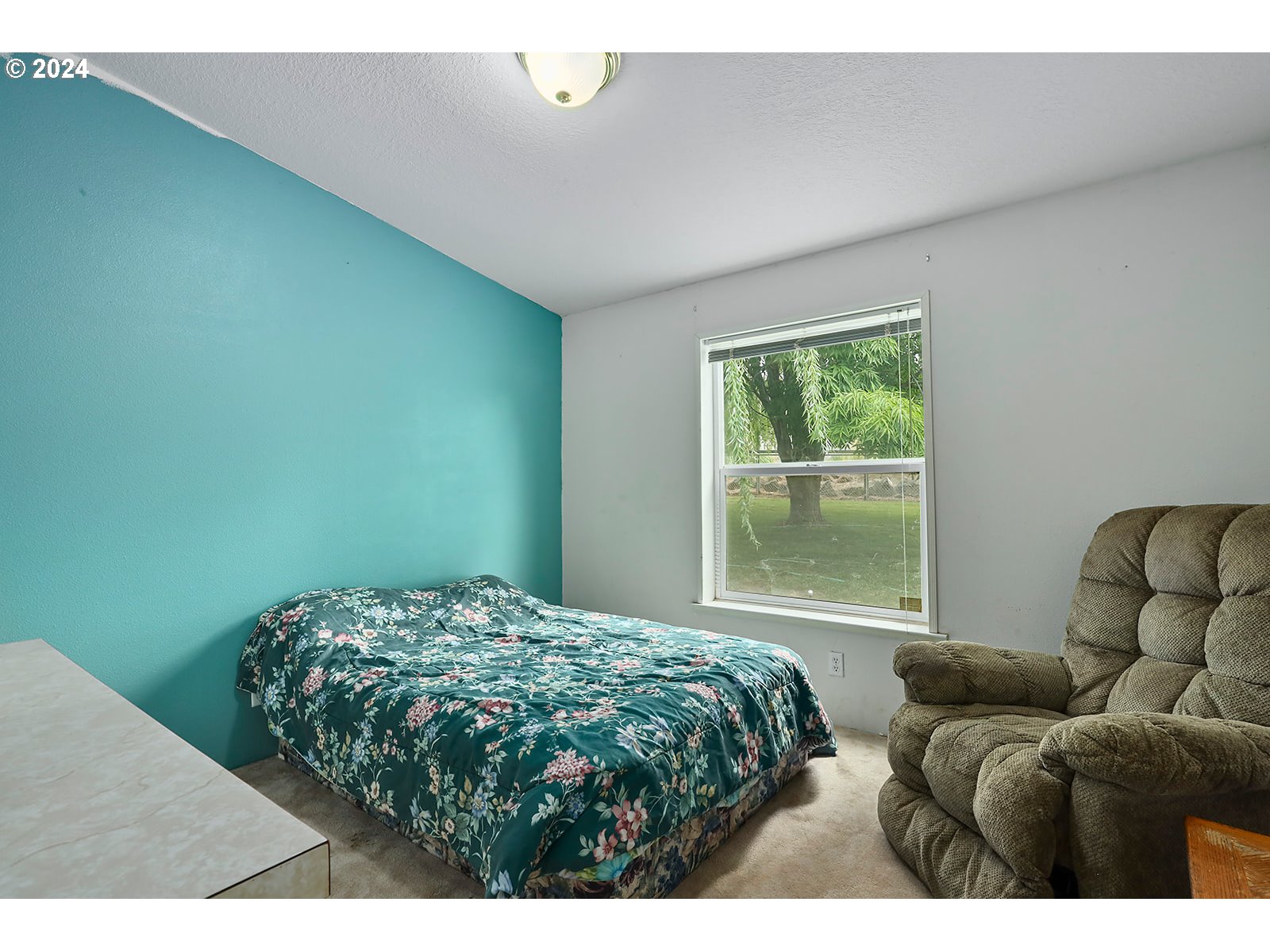 1206 Highway 197 Maupin, OR 97037 - Photo 10 of 31 a bedroom with a bed and a window