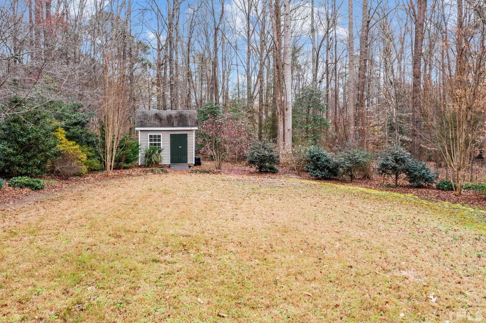 1413 Shady Rise Glen Raleigh, NC 27603 - Photo 11 of 39 a front view of a house with a yard