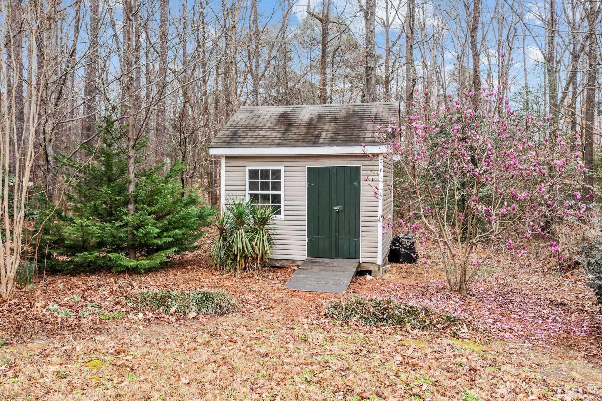 1413 Shady Rise Glen Raleigh, NC 27603 - Photo 12 of 39 a front view of a house with a yard