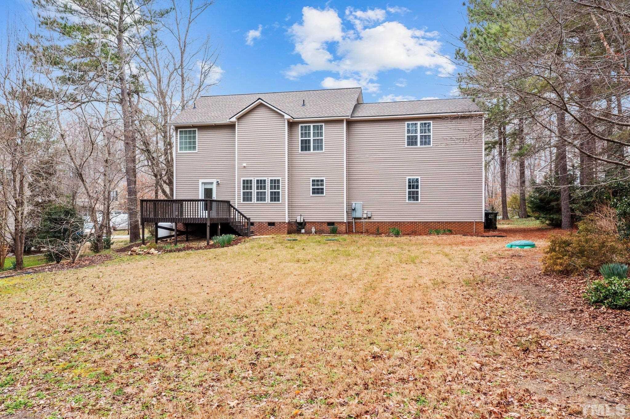 1413 Shady Rise Glen Raleigh, NC 27603 - Photo 16 of 39 a front view of a house with a yard