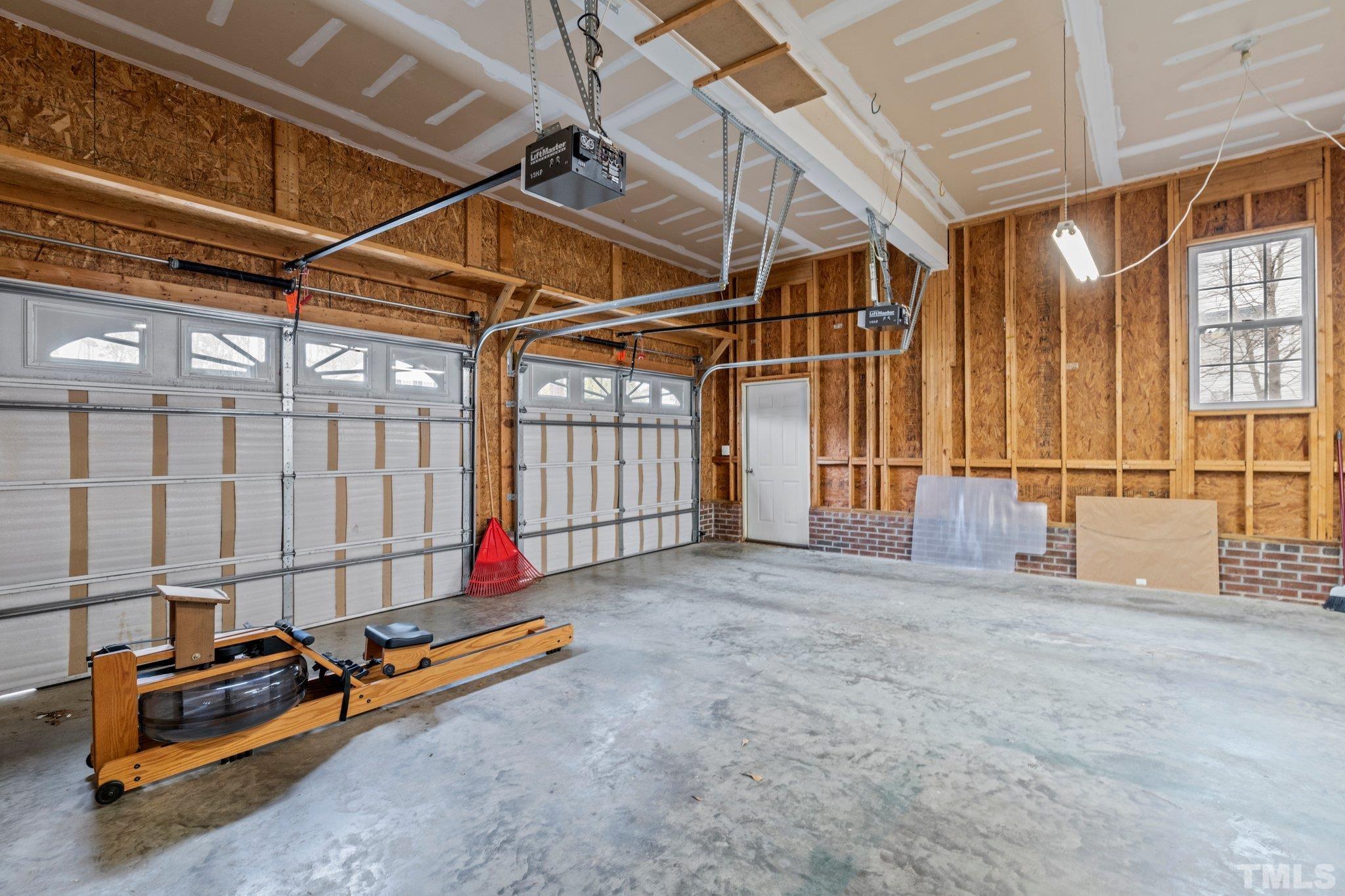1413 Shady Rise Glen Raleigh, NC 27603 - Photo 29 of 39 a view of a room with gym equipment