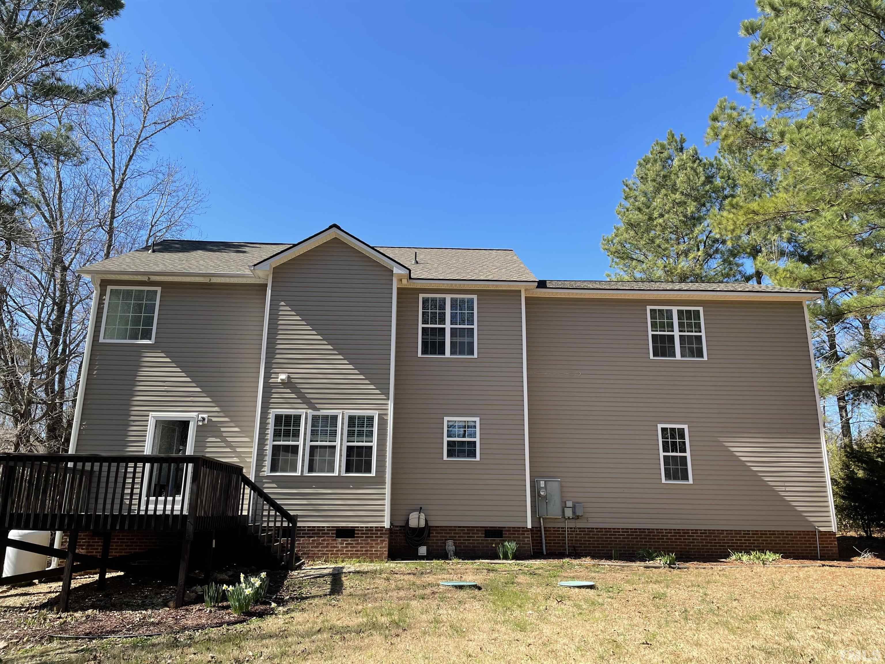 1413 Shady Rise Glen Raleigh, NC 27603 - Photo 4 of 39 a front view of a house with a yard
