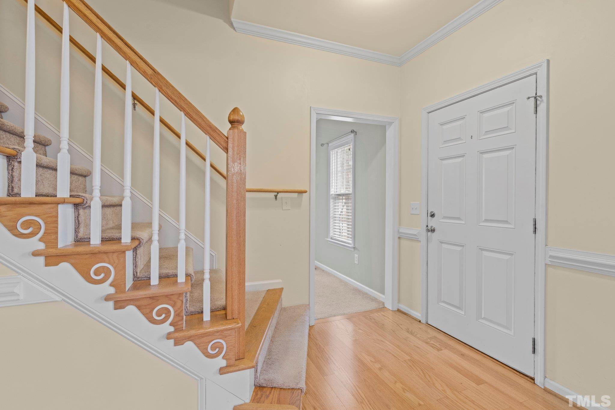 1413 Shady Rise Glen Raleigh, NC 27603 - Photo 7 of 39 a view of a hallway with windows and stairs
