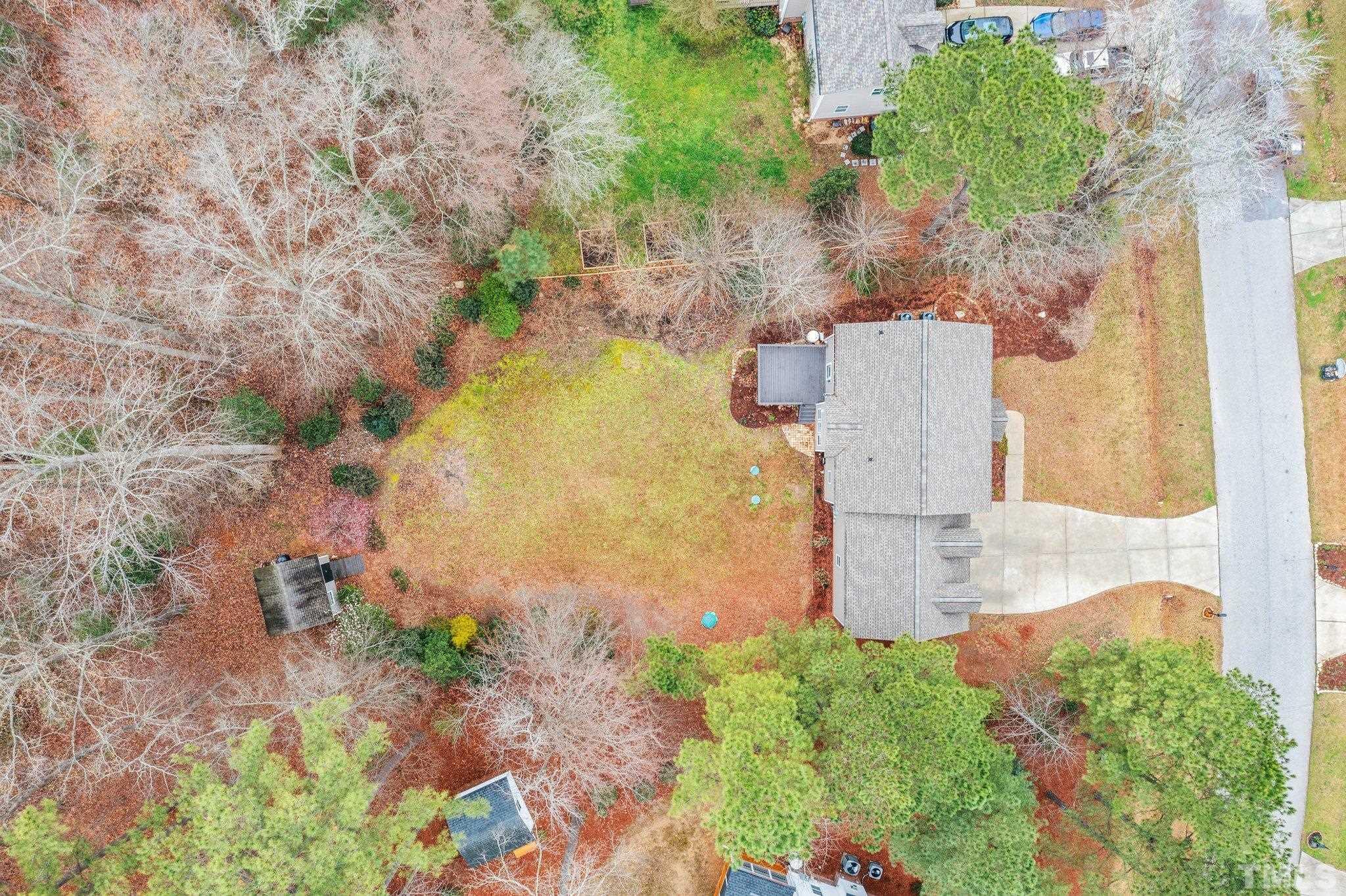 1413 Shady Rise Glen Raleigh, NC 27603 - Photo 8 of 39 a view of a yard with plants