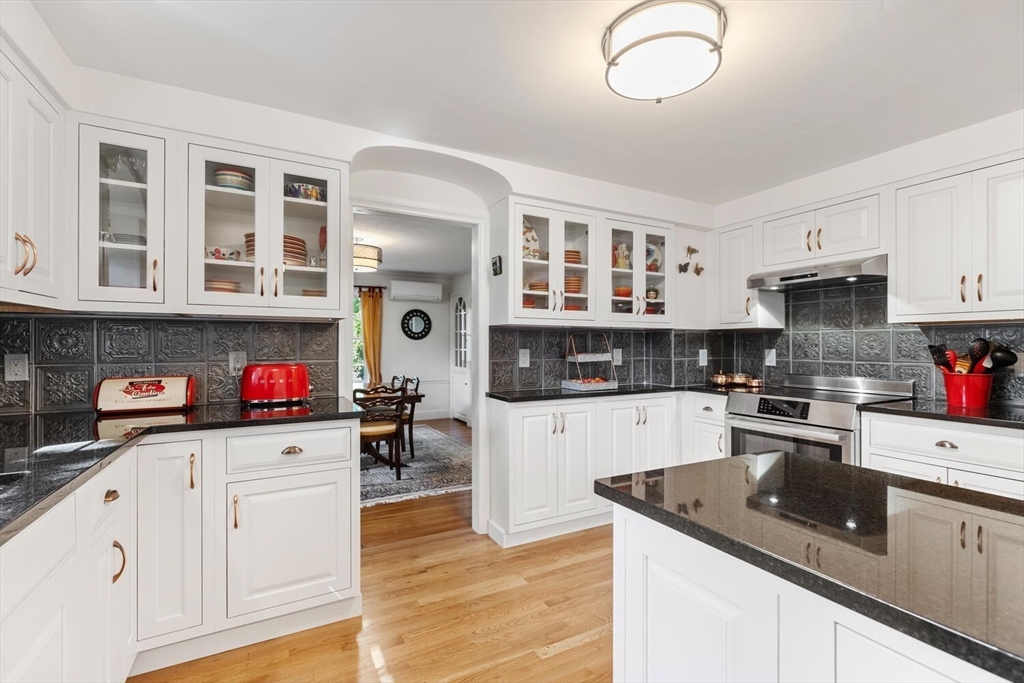 8 Monadnock Road Arlington, MA 02476 - Photo 11 of 37 a kitchen with stainless steel appliances granite countertop a stove and cabinets