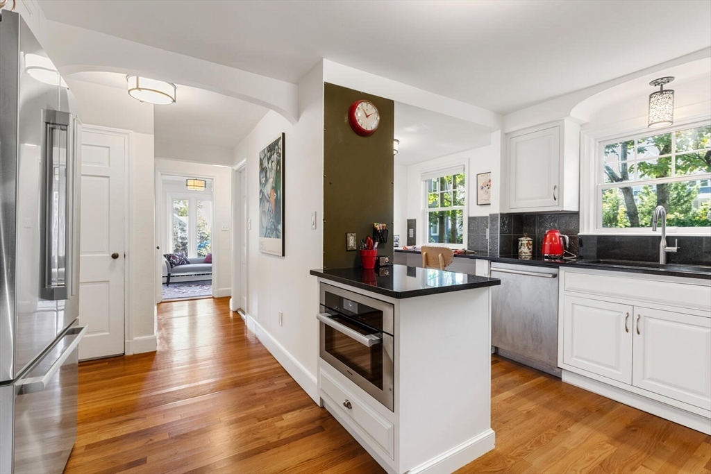 8 Monadnock Road Arlington, MA 02476 - Photo 12 of 37 a kitchen with stainless steel appliances granite countertop a stove and cabinets