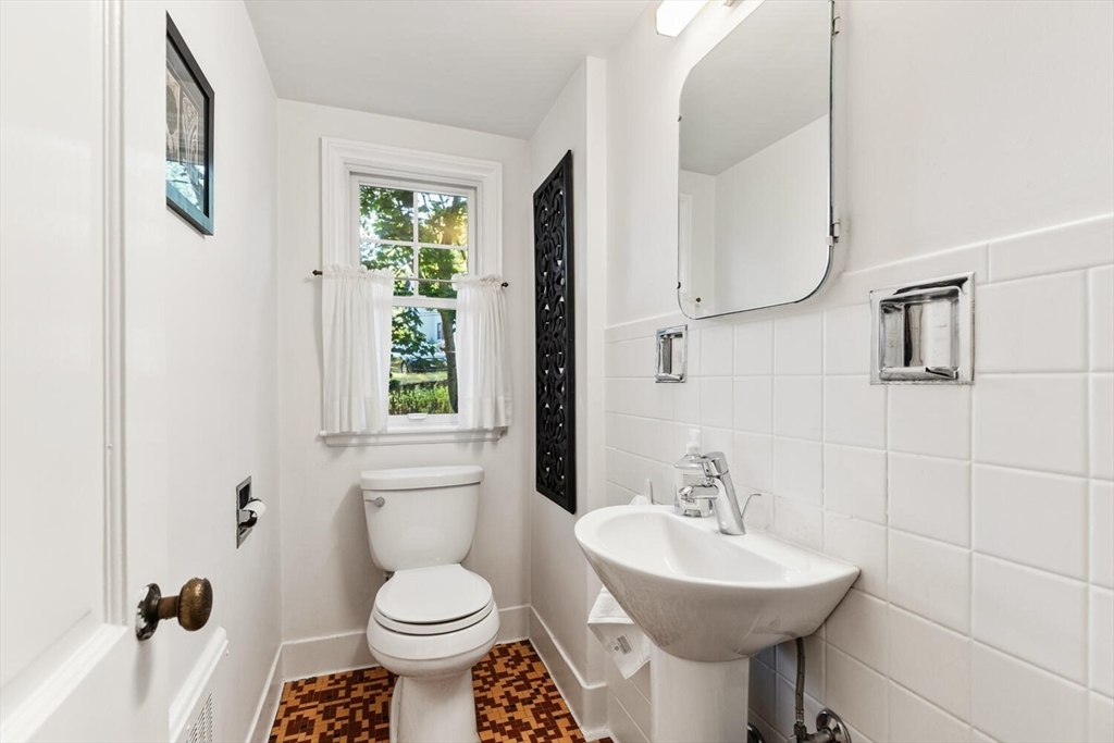 8 Monadnock Road Arlington, MA 02476 - Photo 18 of 37 a bathroom with a sink toilet and a mirror