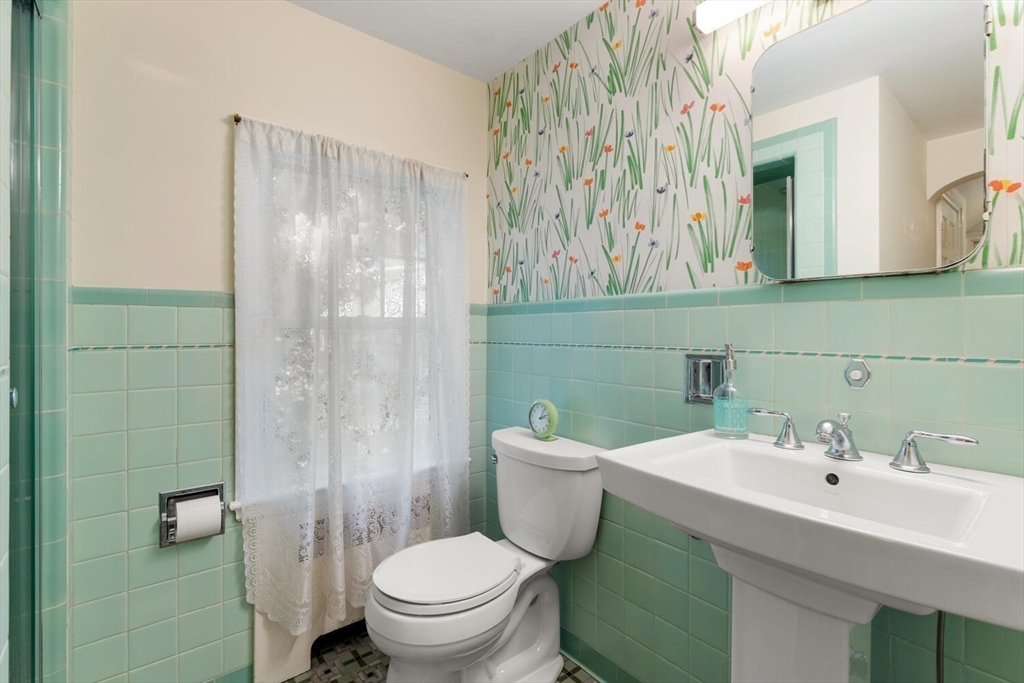 8 Monadnock Road Arlington, MA 02476 - Photo 23 of 37 a bathroom with a sink toilet and shower