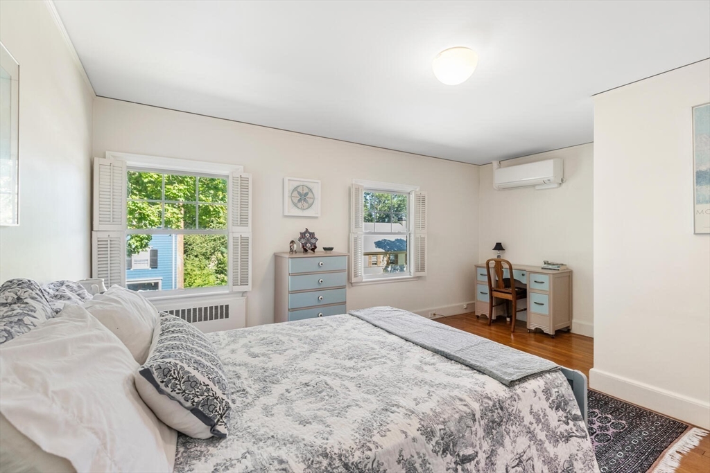 8 Monadnock Road Arlington, MA 02476 - Photo 24 of 37 a bedroom with a bed and a window