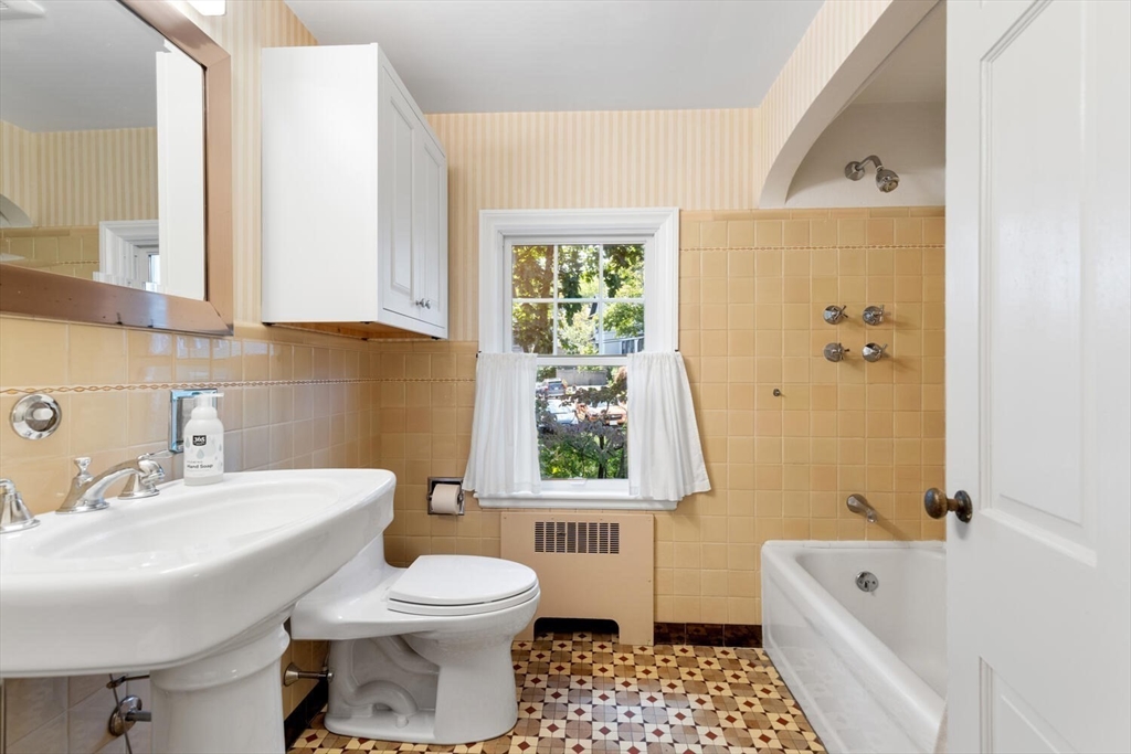 8 Monadnock Road Arlington, MA 02476 - Photo 27 of 37 a bathroom with a sink a toilet and a bathtub