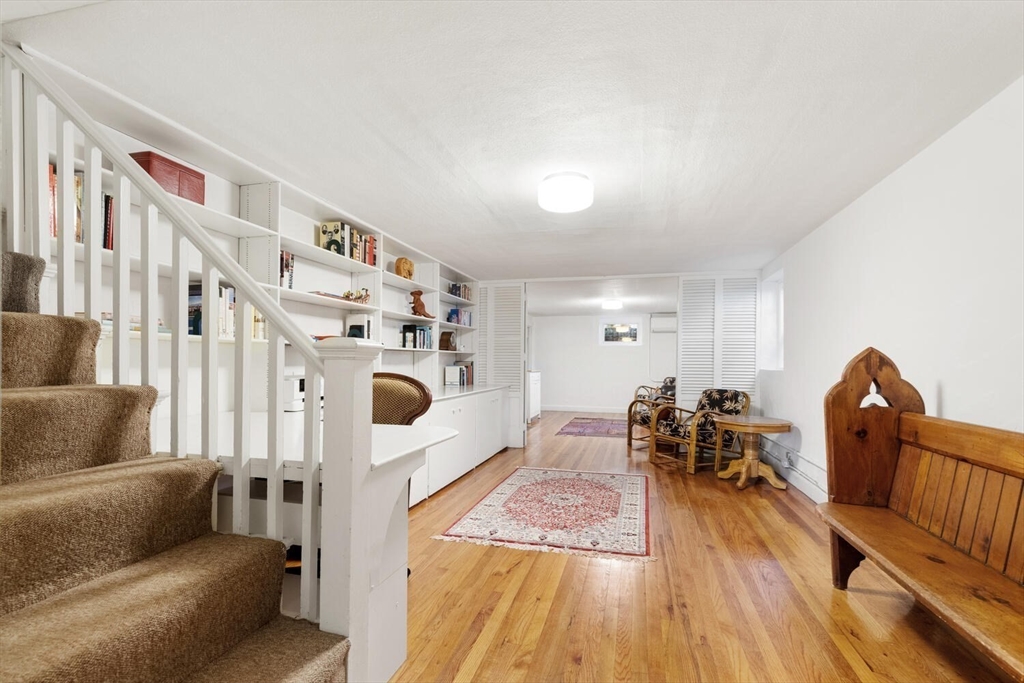 8 Monadnock Road Arlington, MA 02476 - Photo 28 of 37 a living room with furniture and a fireplace