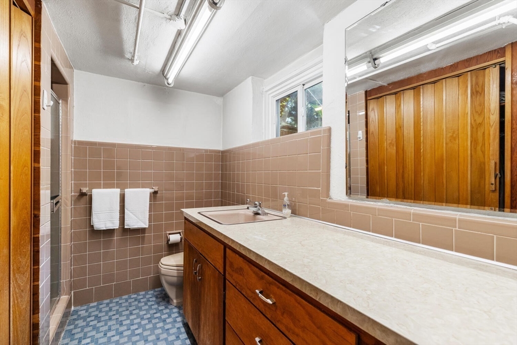 8 Monadnock Road Arlington, MA 02476 - Photo 30 of 37 a bathroom with a sink and a mirror