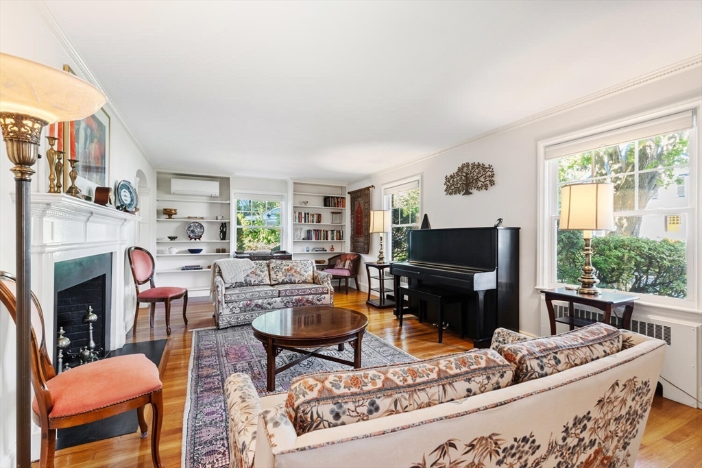 8 Monadnock Road Arlington, MA 02476 - Photo 5 of 37 a living room with furniture a fireplace and a large window