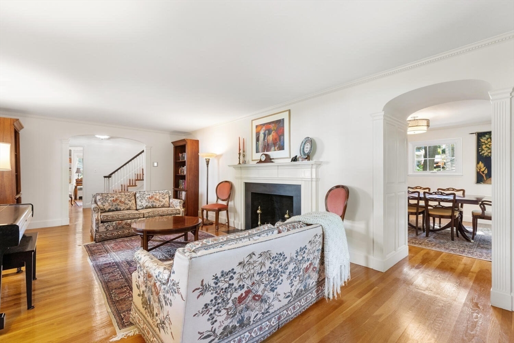 8 Monadnock Road Arlington, MA 02476 - Photo 6 of 37 a living room with fireplace furniture and a wooden floor