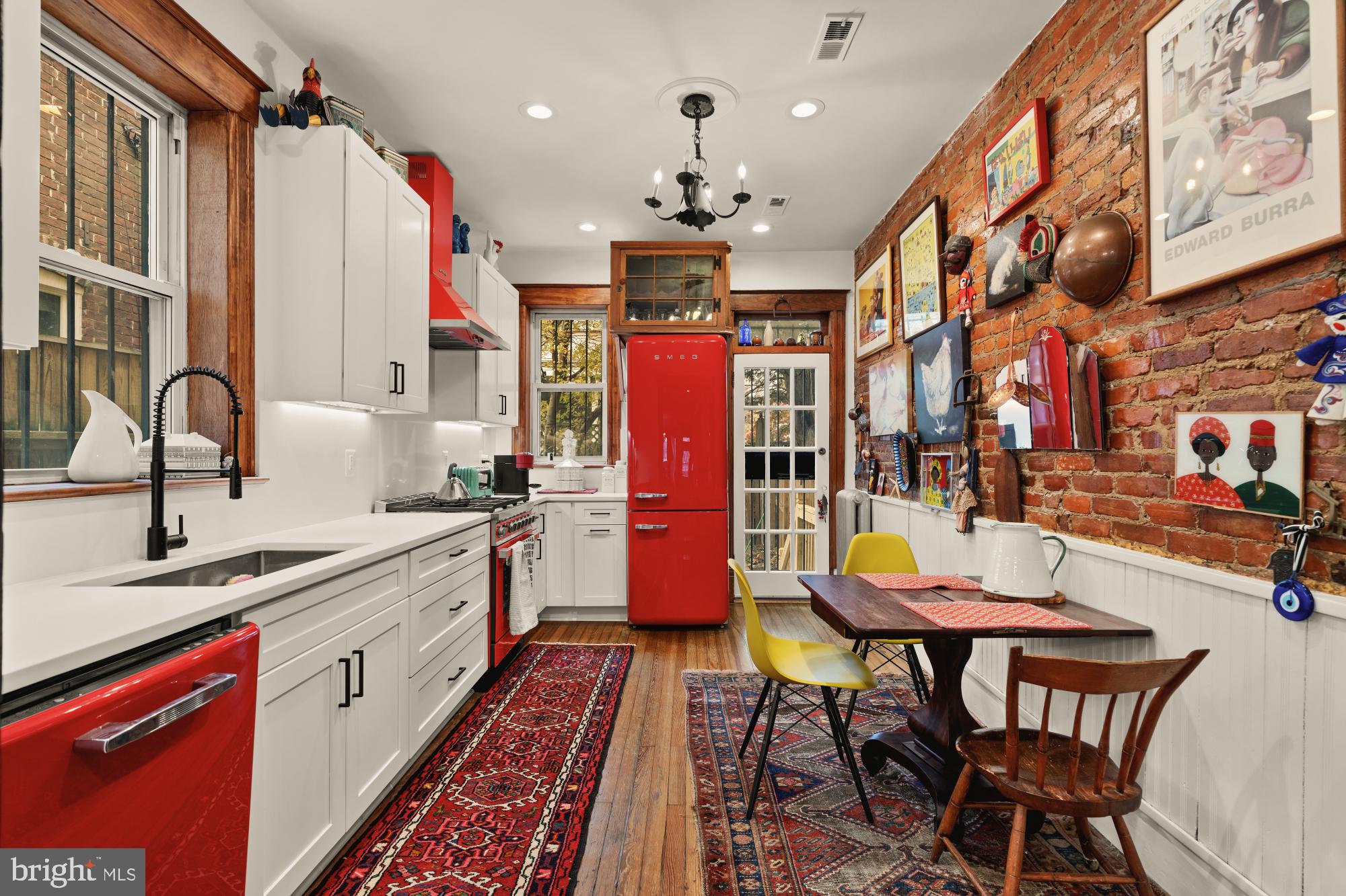 543 11th Street Southeast Washington, DC 20003 - Photo 13 of 41 a kitchen with stainless steel appliances granite countertop a stove a sink dishwasher and cabinets with wooden floor