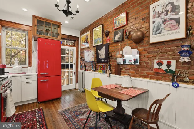 a dining room with furniture and a chandelier