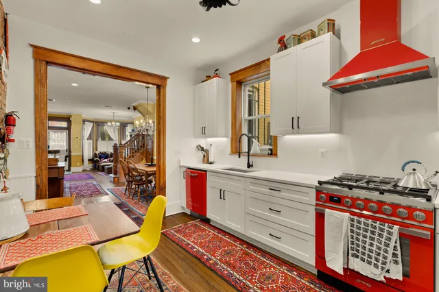 a kitchen with sink and cabinets