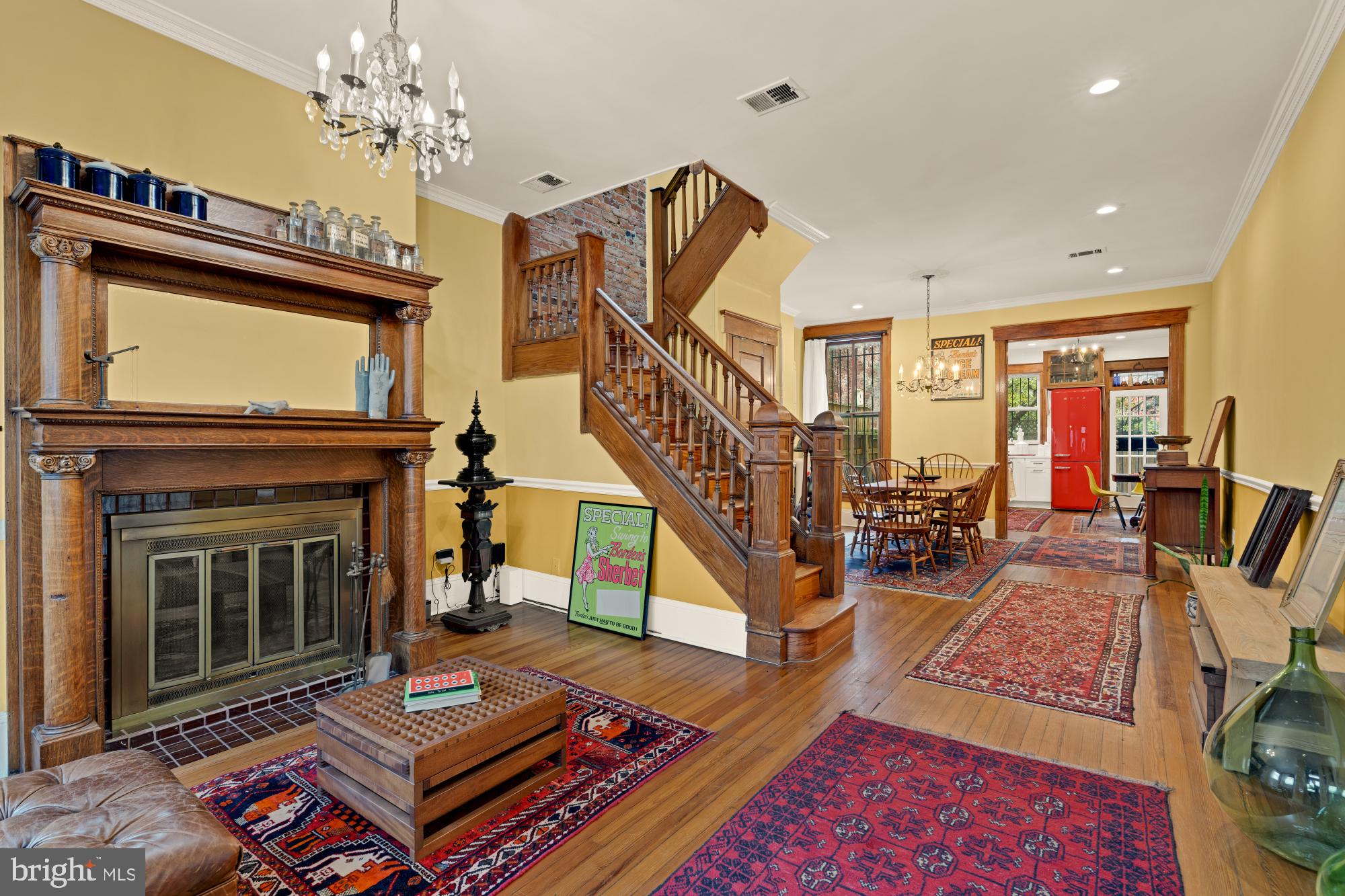 543 11th Street Southeast Washington, DC 20003 - Photo 2 of 41 a living room with furniture a rug and a fireplace