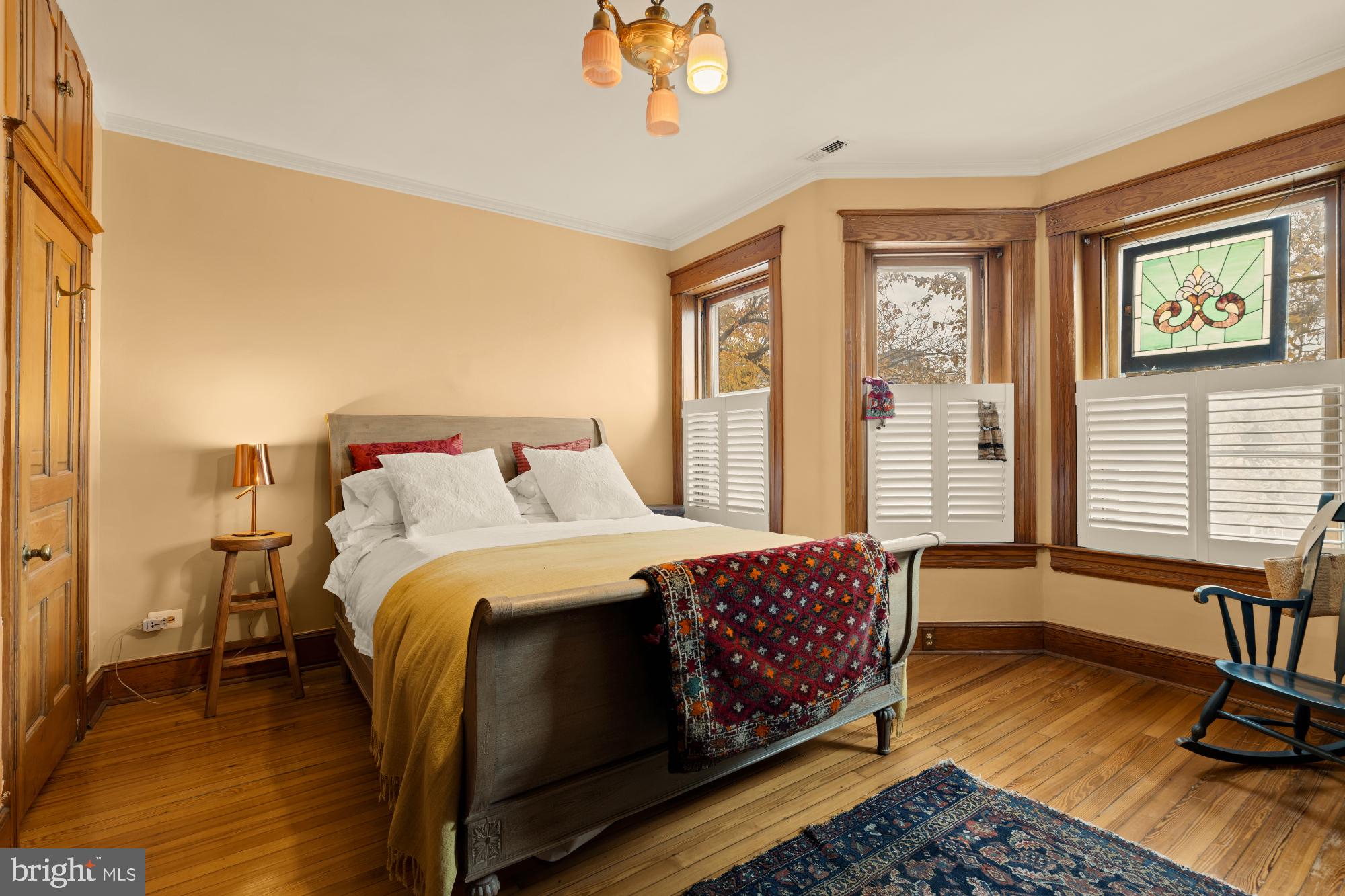 543 11th Street Southeast Washington, DC 20003 - Photo 24 of 41 a bedroom with a bed dresser and a window