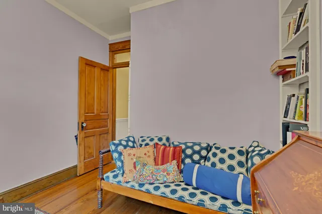 a bedroom with a bed and a mirror