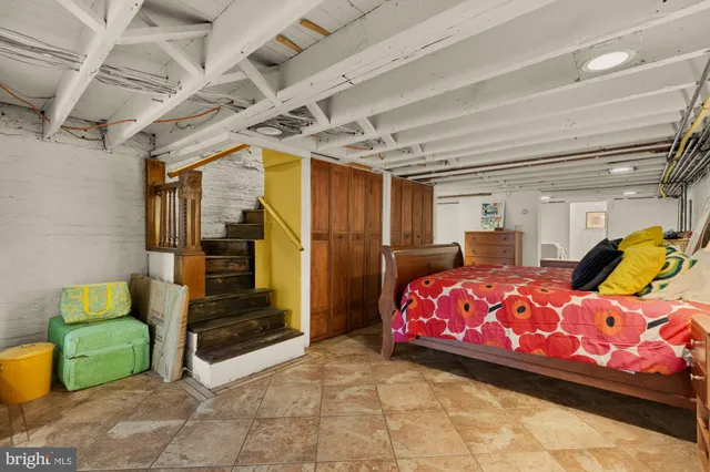 a bedroom with a bed and a table