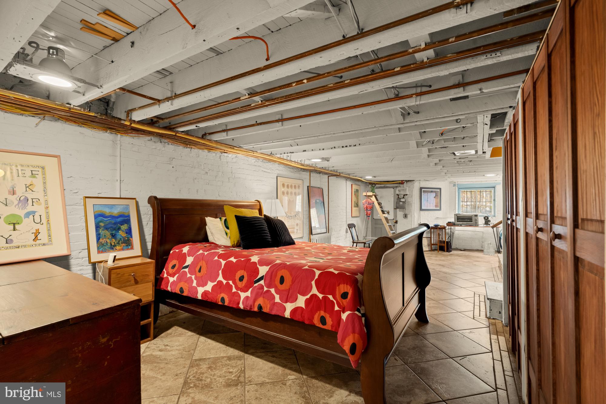 543 11th Street Southeast Washington, DC 20003 - Photo 36 of 41 a bedroom with a bed and a table