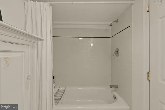 a picture of a bathroom with mirror