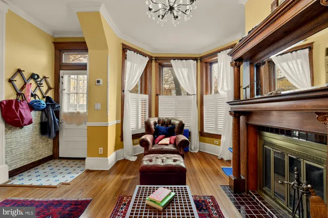 a bedroom with furniture and a fireplace