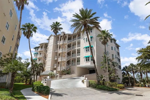 a view of a palm trees in front of a building