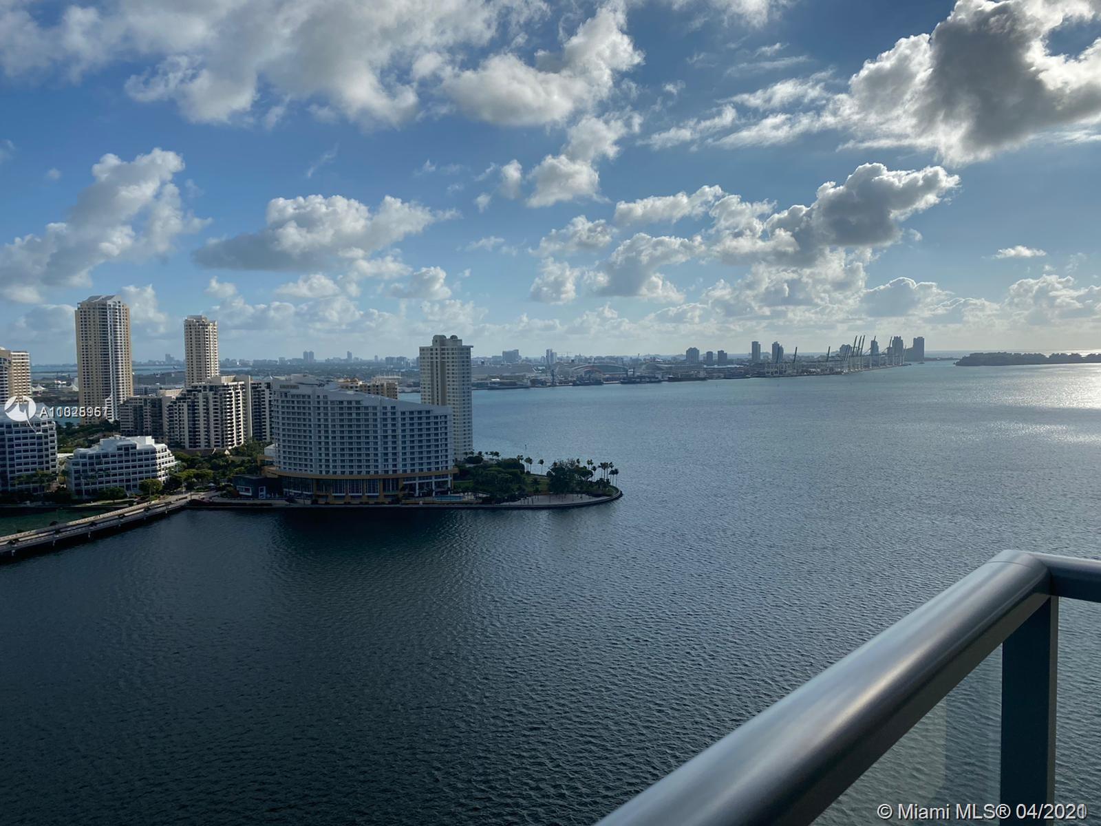 1155 Brickell Bay Drive, Unit 3008 Miami, FL 33131 - Photo 2 of 21 a view of a lake with beach
