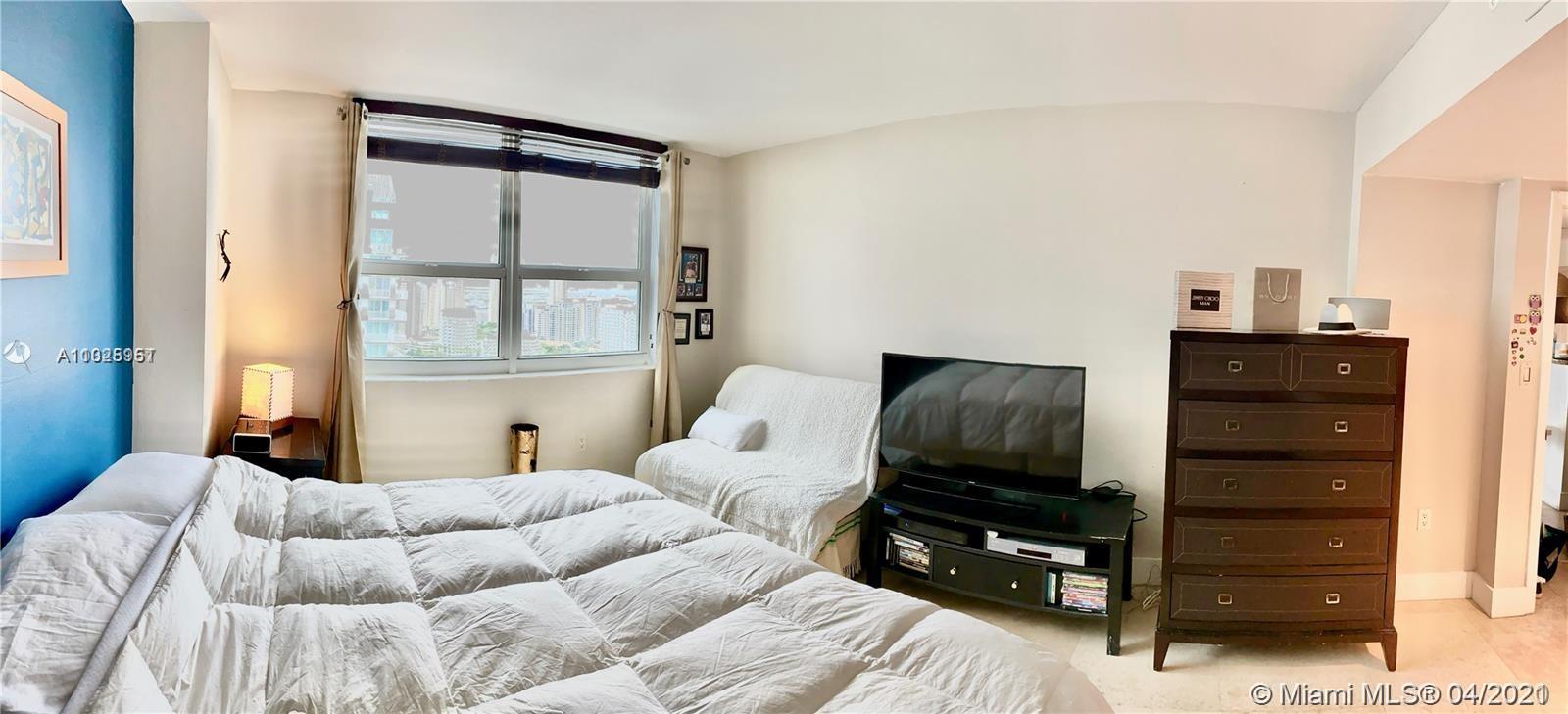 1155 Brickell Bay Drive, Unit 3008 Miami, FL 33131 - Photo 12 of 21 a bedroom with a bed and a television