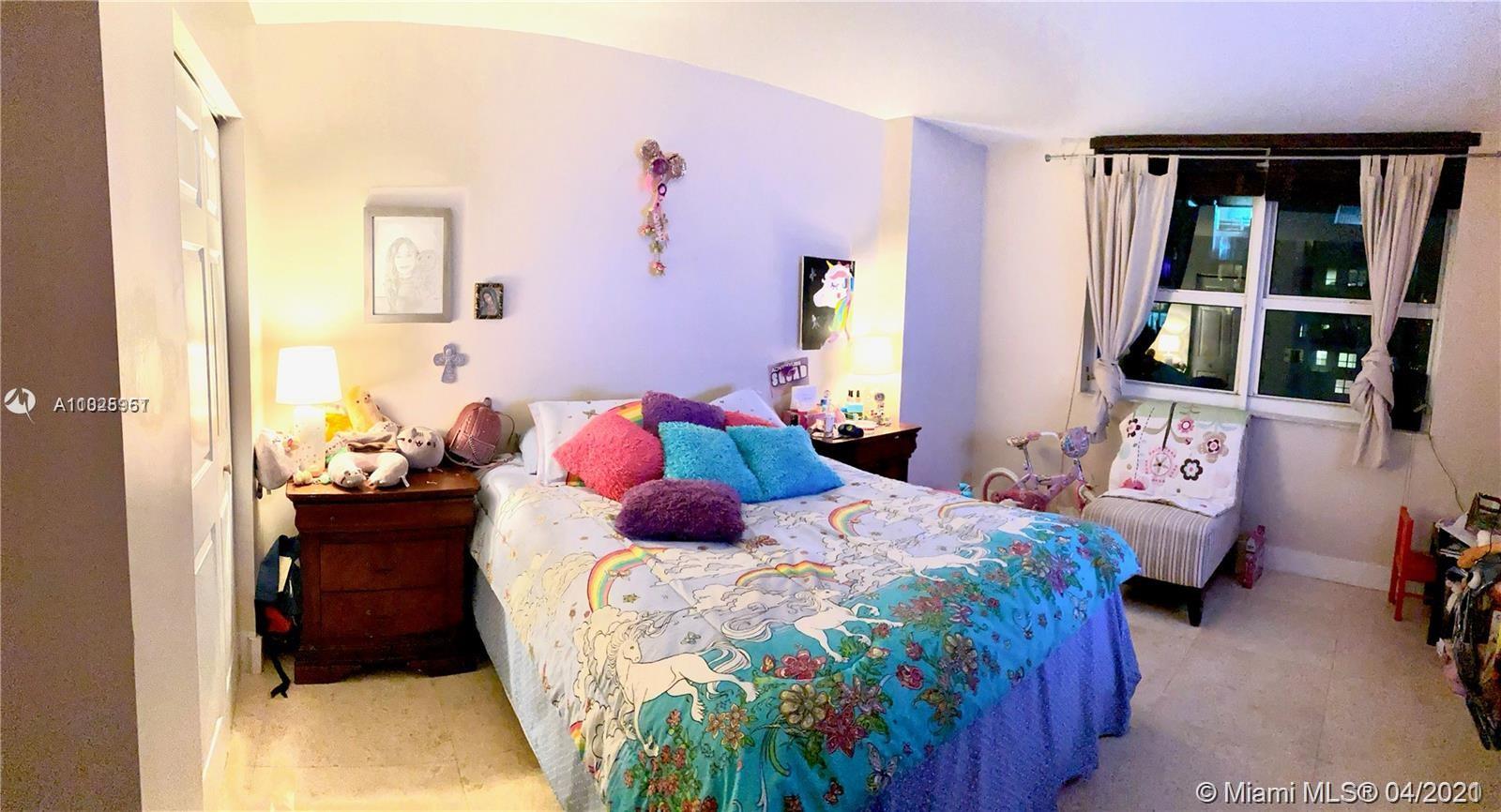 1155 Brickell Bay Drive, Unit 3008 Miami, FL 33131 - Photo 17 of 21 a bedroom with a bed and wooden floor