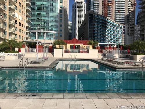 1155 Brickell Bay Drive, Unit 3008 Miami, FL 33131 - Photo 18 of 21 a view of a swimming pool with a patio