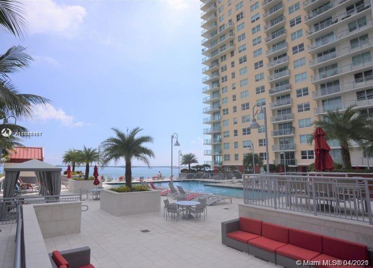 1155 Brickell Bay Drive, Unit 3008 Miami, FL 33131 - Photo 19 of 21 a view of a swimming pool with outdoor seating