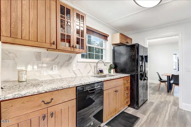 a kitchen with stainless steel appliances granite countertop a stove and a microwave