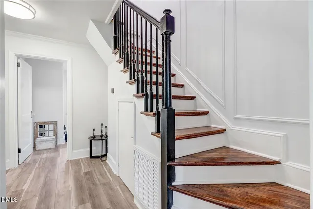 a bathroom with a sink a toilet and a window