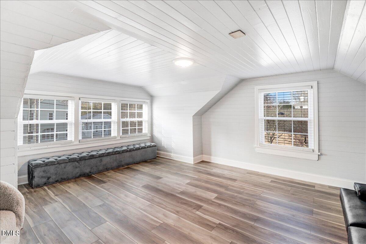 313 South 4th Street Smithfield, NC 27577 - Photo 21 of 31 an empty room with wooden floor and windows