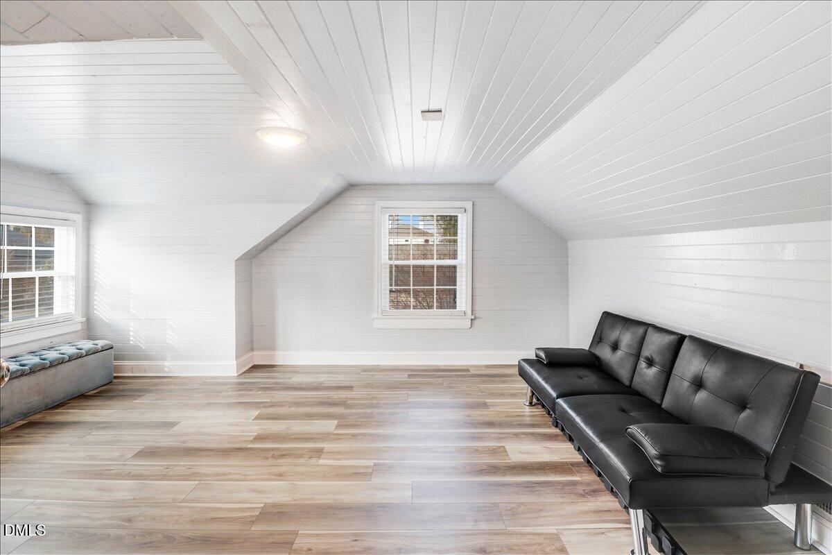 313 South 4th Street Smithfield, NC 27577 - Photo 22 of 31 a view of an empty room with wooden floor and a window