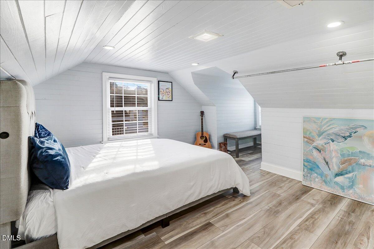 313 South 4th Street Smithfield, NC 27577 - Photo 24 of 31 a bedroom with a bed and a large window