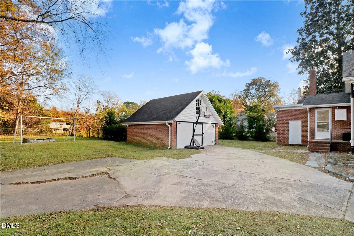 313 South 4th Street Smithfield, NC 27577 - Photo 28 of 31 a view of a house with a yard and pathway