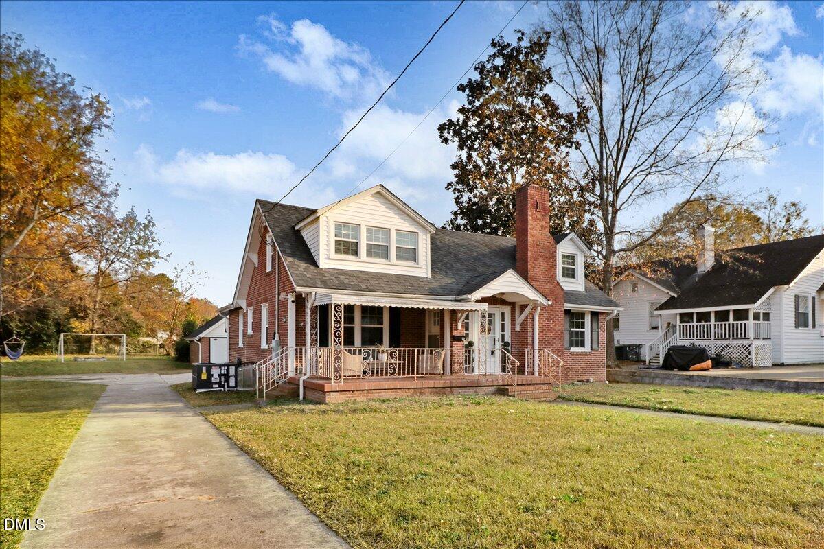 313 South 4th Street Smithfield, NC 27577 - Photo 3 of 31 a front view of a house with swimming pool