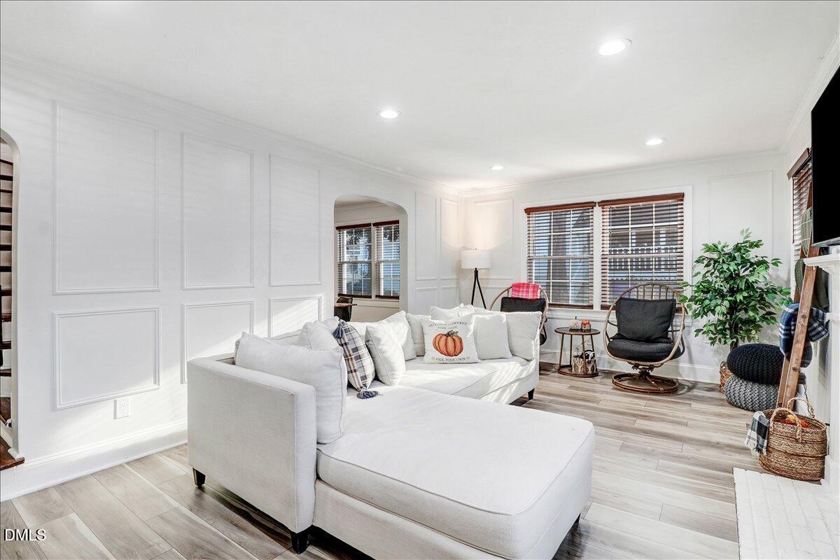 313 South 4th Street Smithfield, NC 27577 - Photo 4 of 31 a living room with furniture and a potted plant