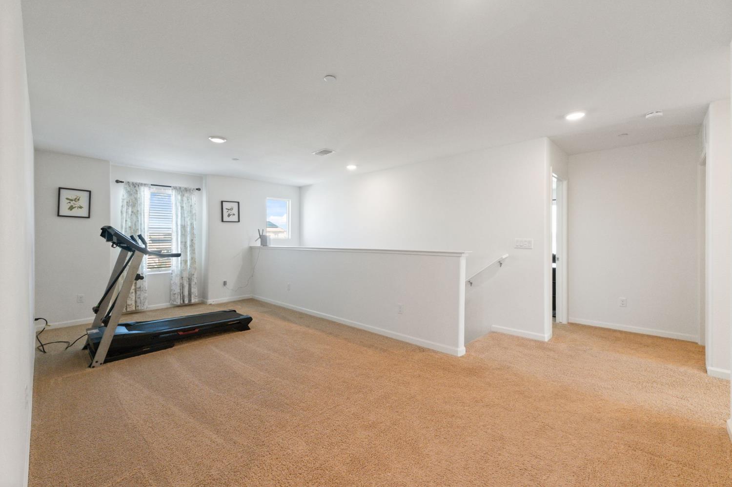 802 Riesling Lane Coalinga, CA 93210 - Photo 16 of 68 a view of a room with gym equipment