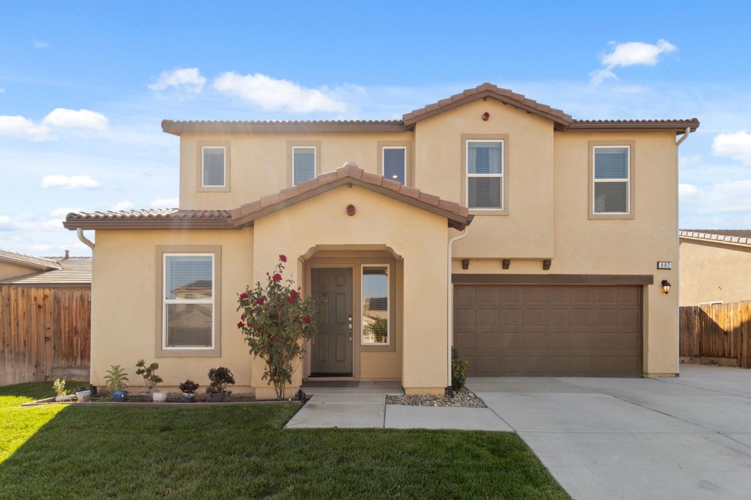 802 Riesling Lane Coalinga, CA 93210 - Photo 2 of 68 a front view of a house with a yard