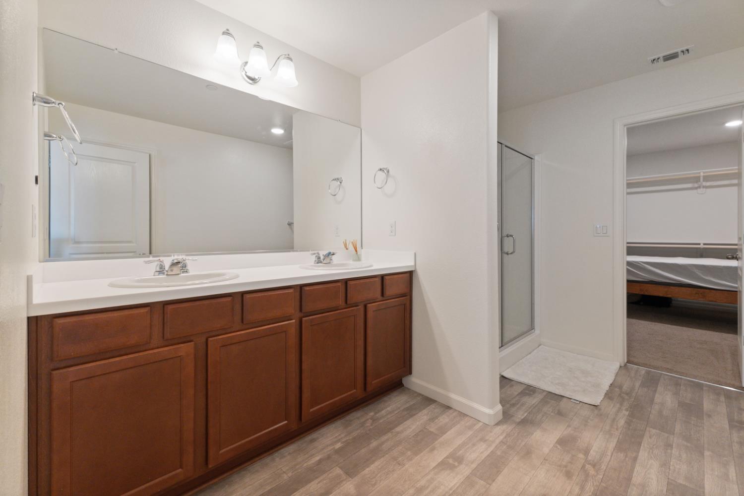 802 Riesling Lane Coalinga, CA 93210 - Photo 36 of 68 a bathroom with a double vanity sink a and a mirror