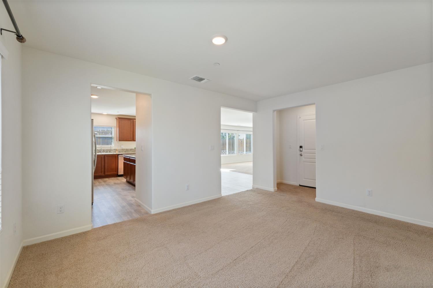 802 Riesling Lane Coalinga, CA 93210 - Photo 54 of 68 a view of a livingroom with a hall and a window