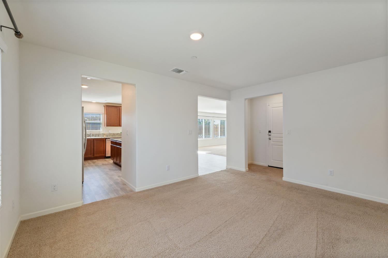 802 Riesling Lane Coalinga, CA 93210 - Photo 55 of 68 a view of a livingroom with a hall and a window