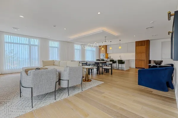 a living room with furniture and a table