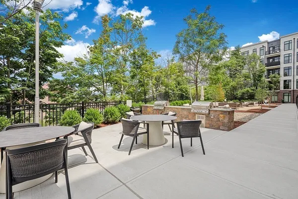 a view of swimming pool with outdoor seating